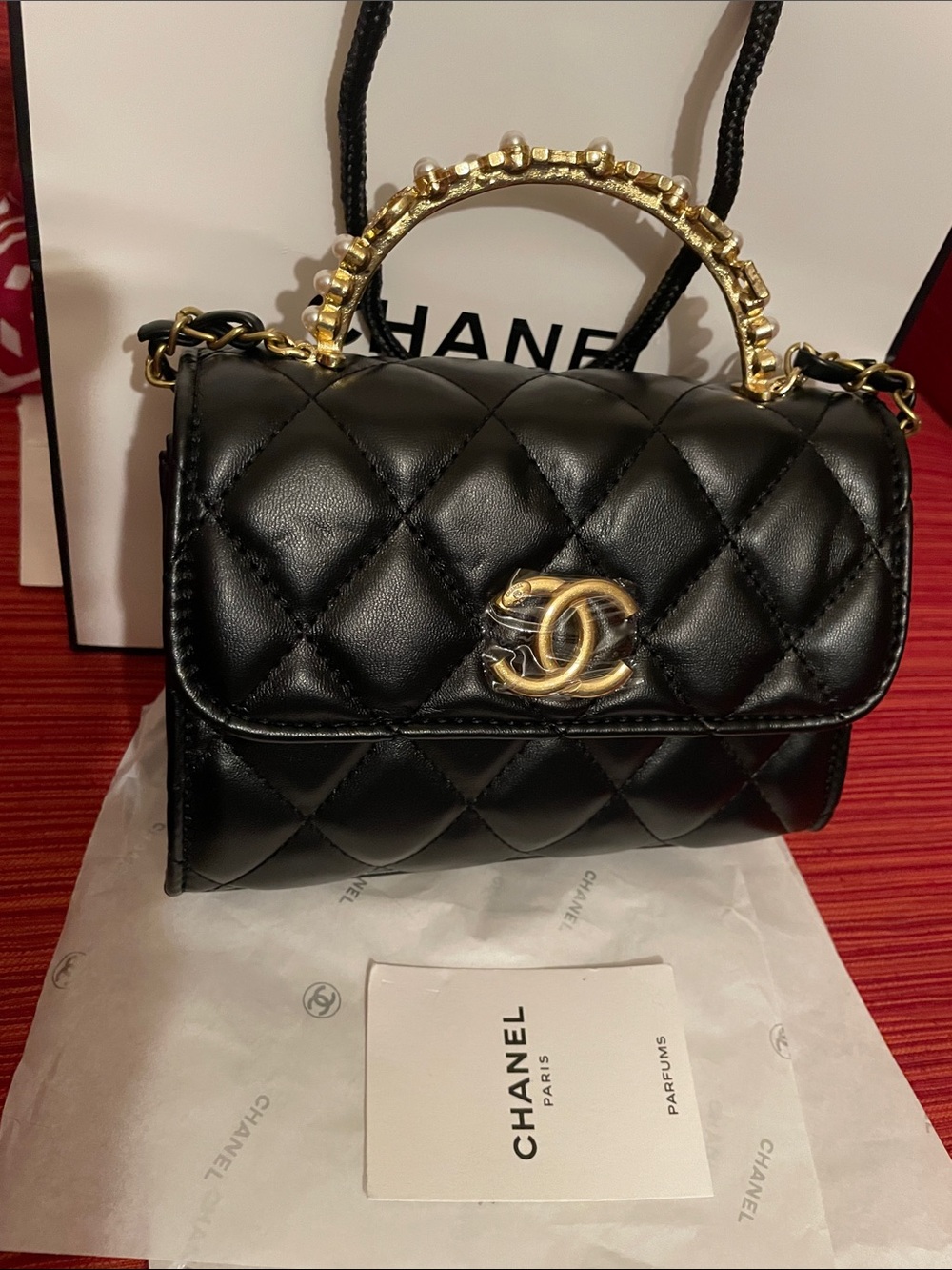 Beaute VIP Black Quilted Mini Top-Handle Bag with Gold Hardware